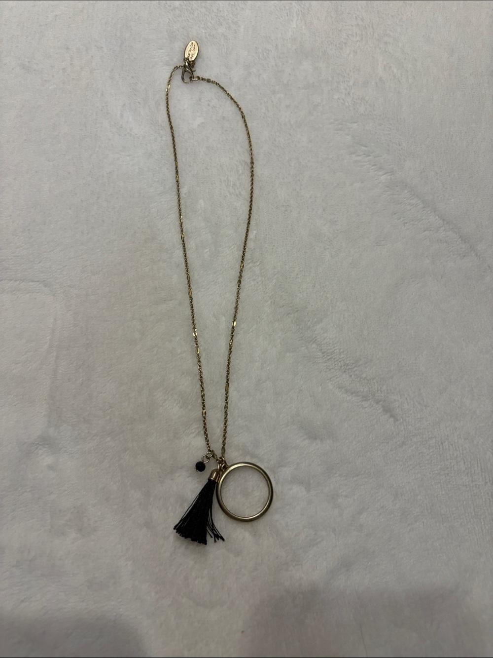 Gold-Tone Necklace with Black Tassel and Ring Pendant